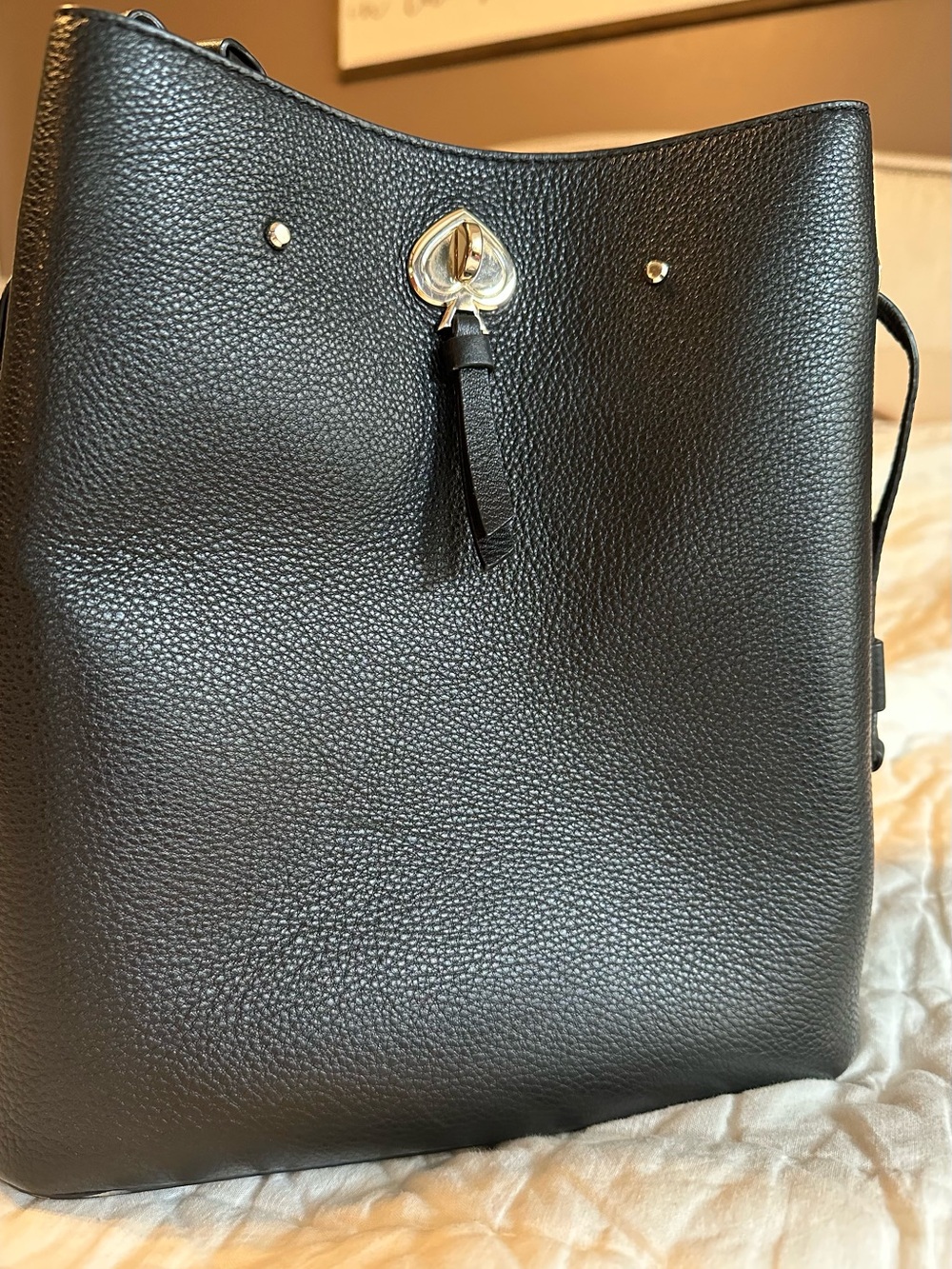 kate spade Black Pebbled Leather Shoulder Bucket with Tassel and Spade Accent